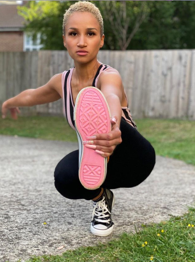 a woman on roller skates sitting in a roller skating rink