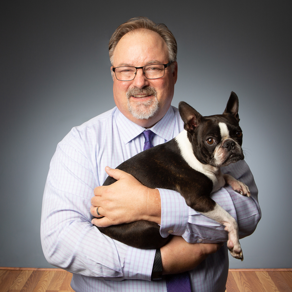 man holding a dog