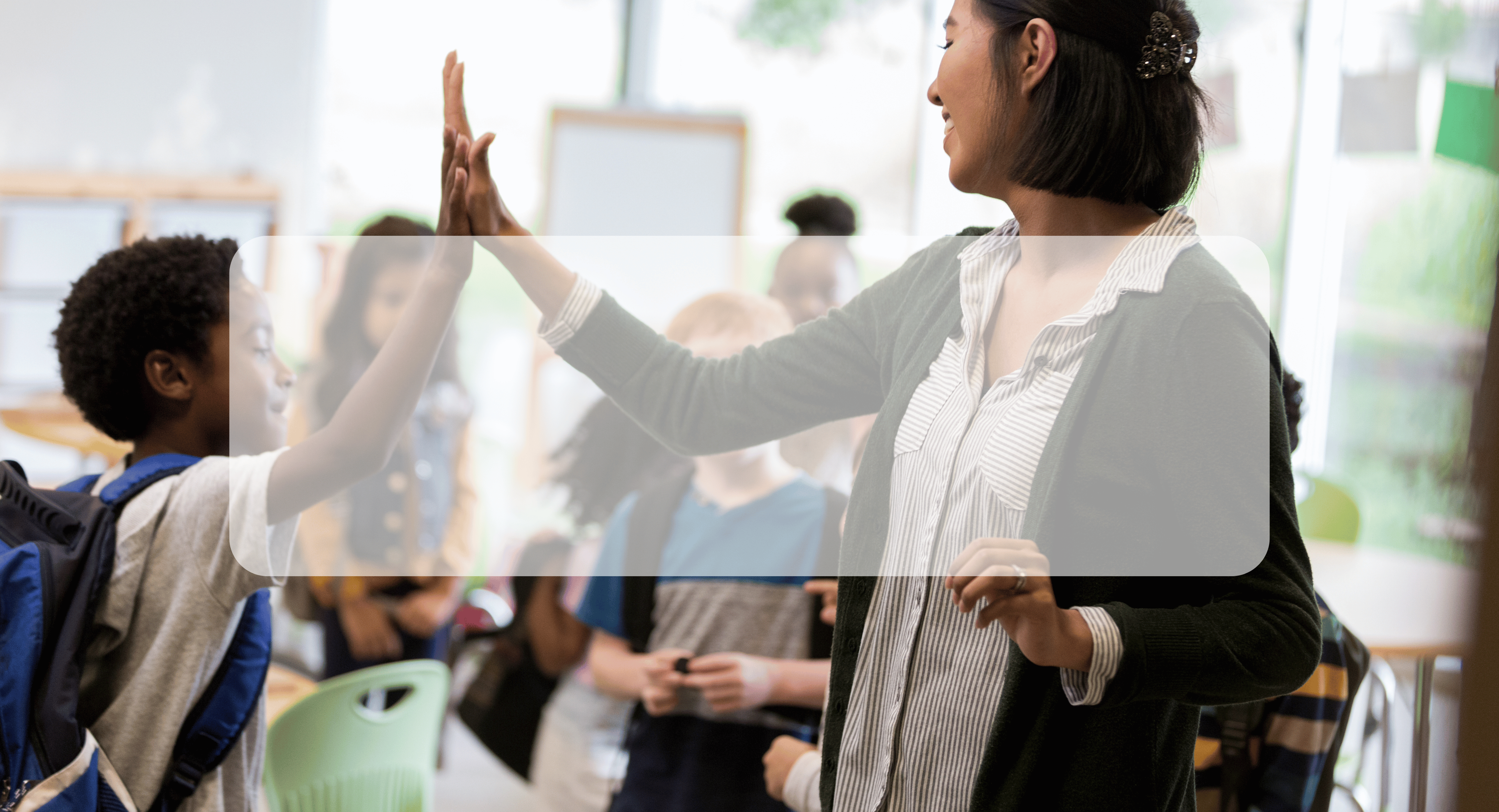 teacher high-fiving student