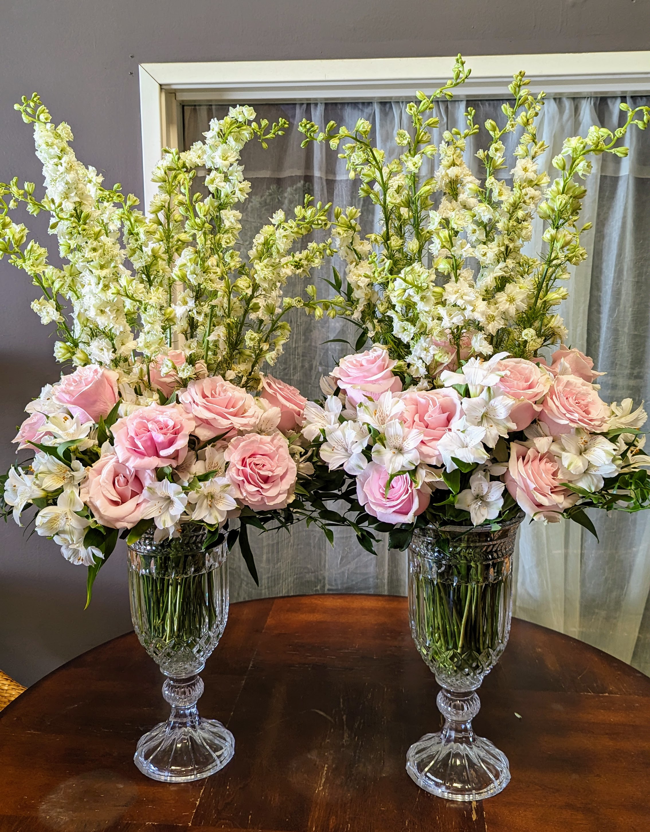Tall Pink and White Flowers in Crystal Vases