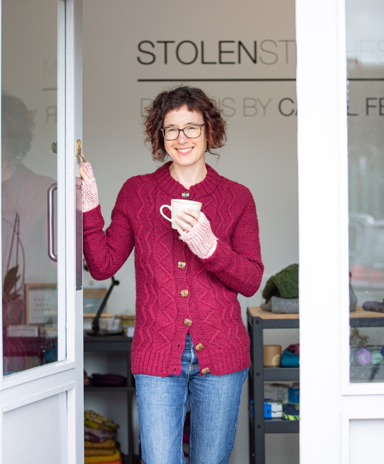 Carol standing with cup in her hand