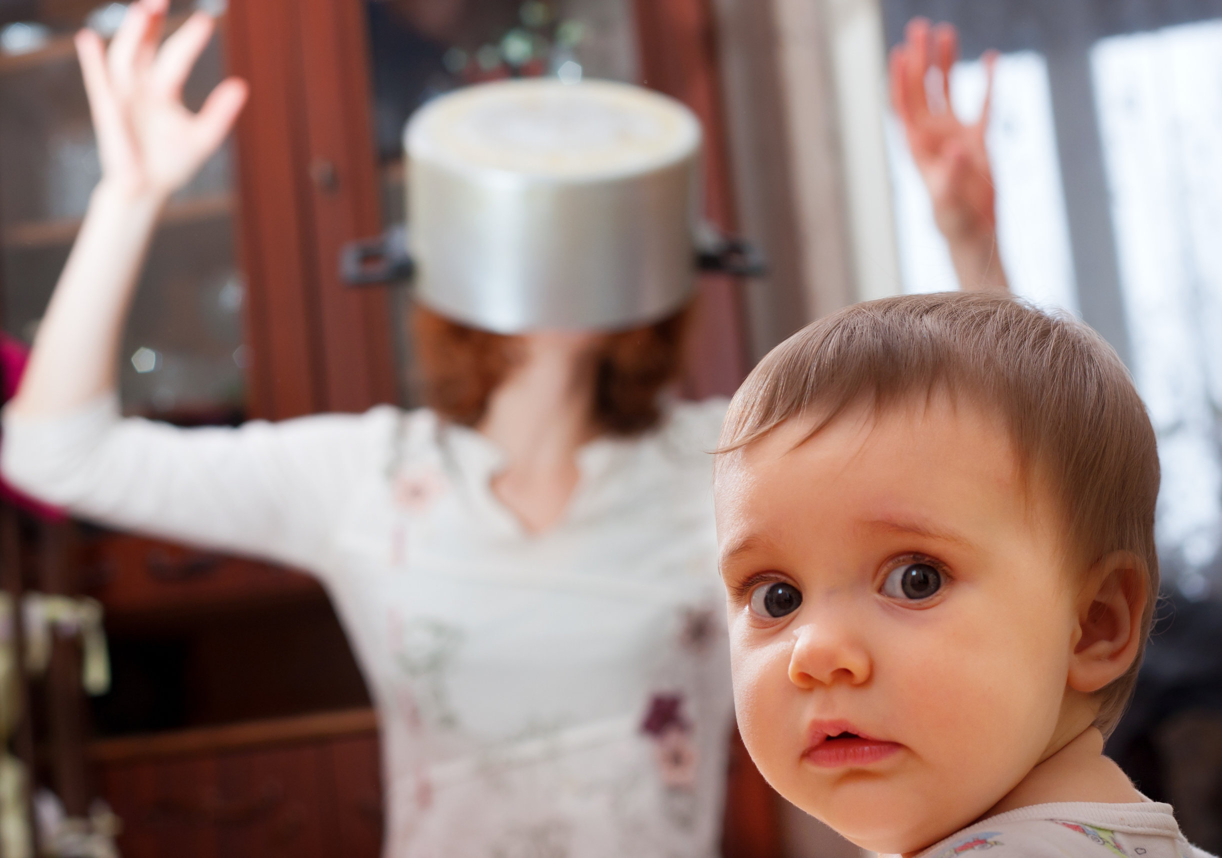 Mom with pot on head with worried child