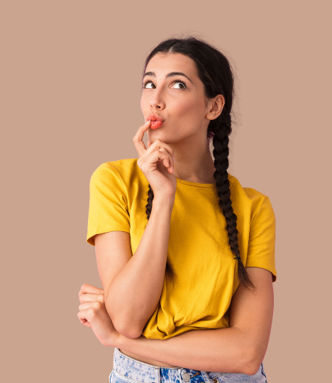 Woman in yellow t shirt looks thoughtful