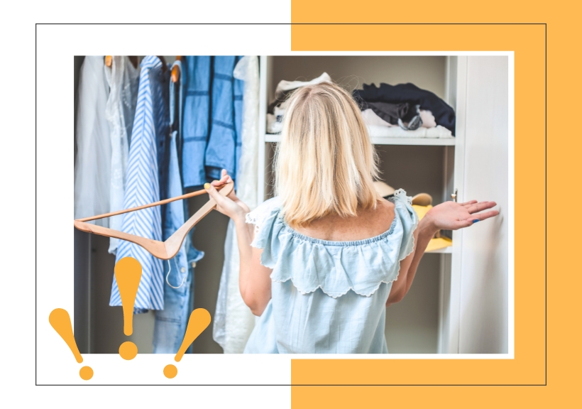 woman standing in front of closet with her arms up in frustration