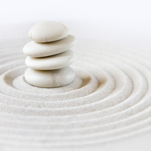 Stacked stones representing the mindfulness of Qigong philosophy and practice