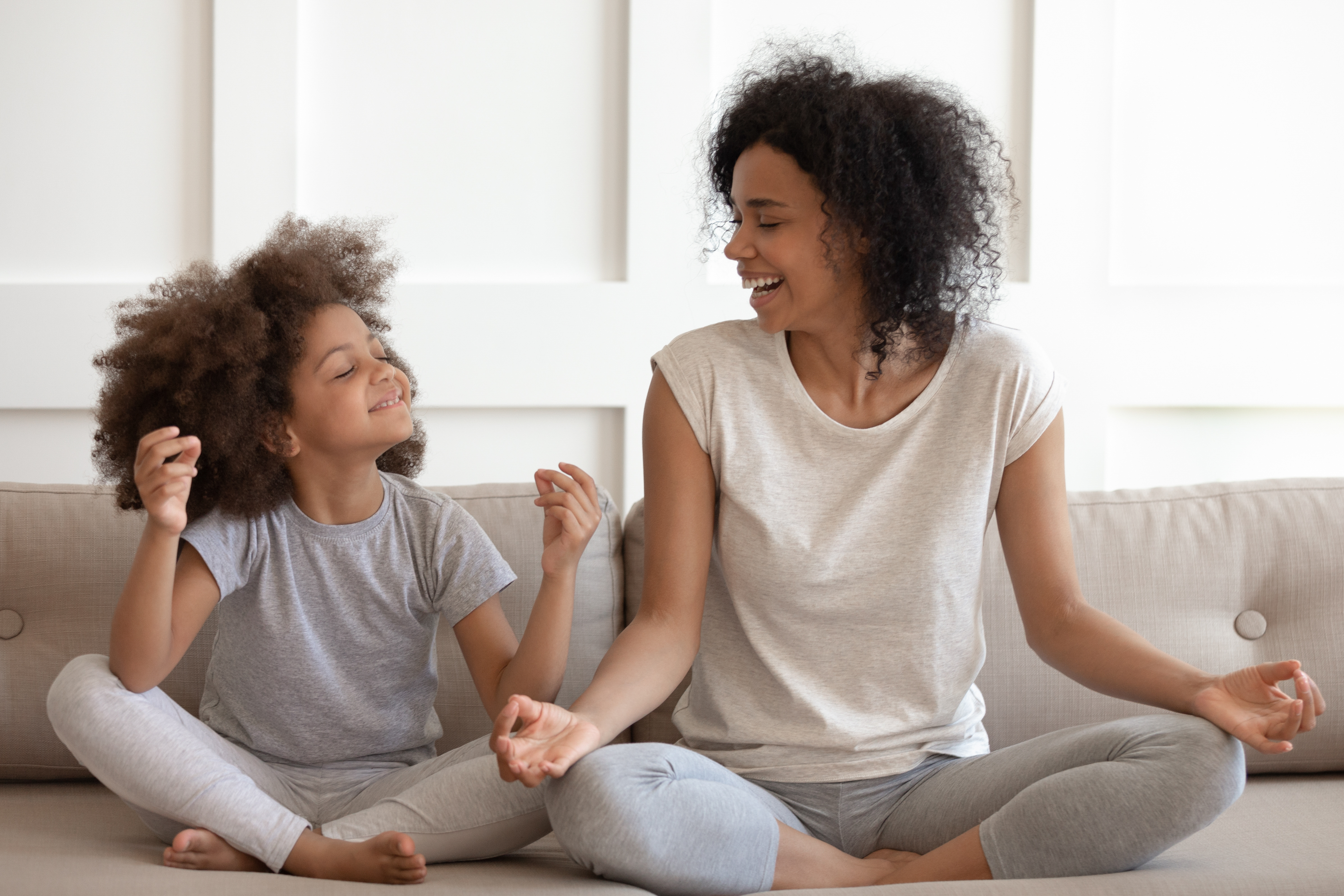 mother child family meditating laughing