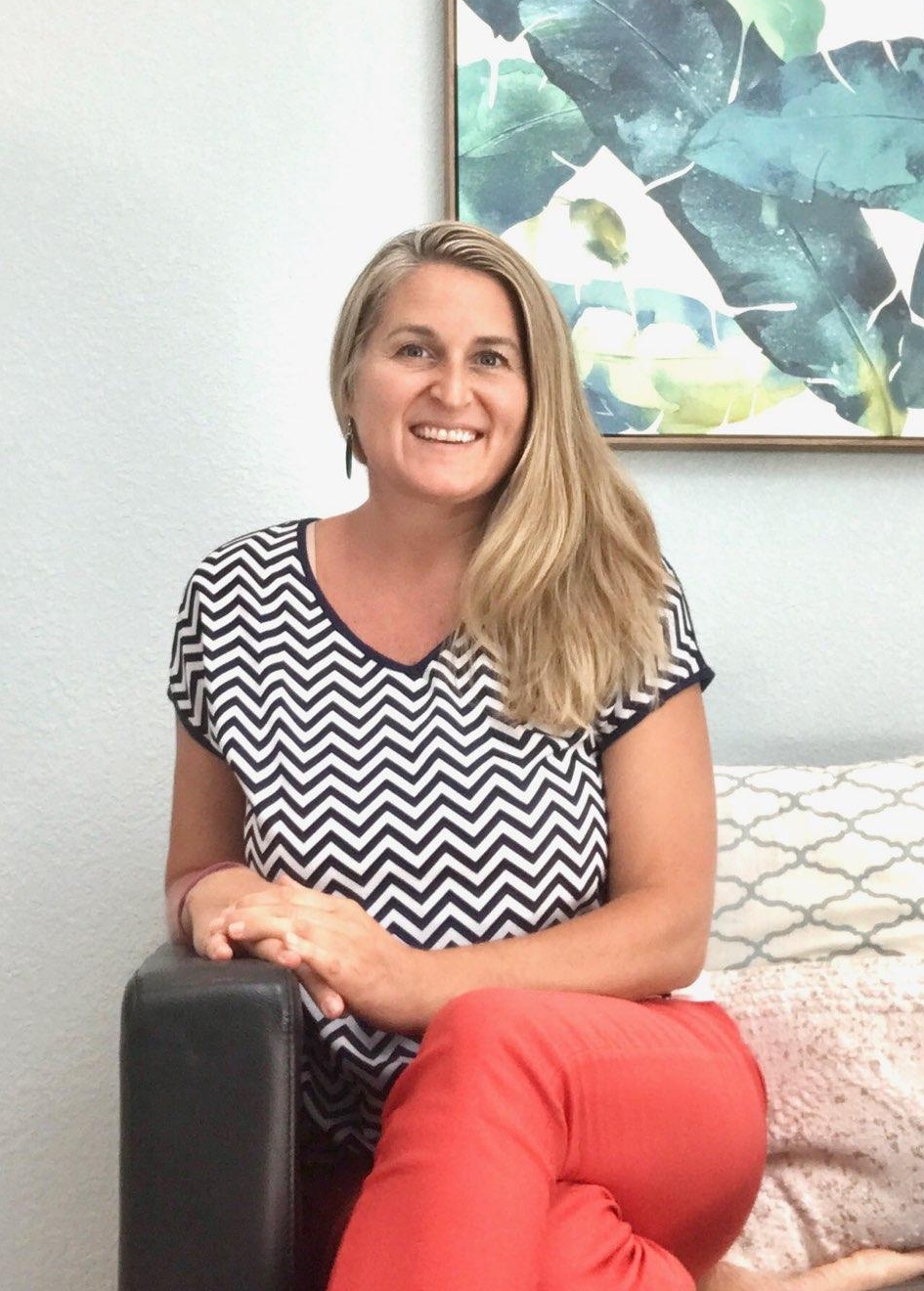 picture of Amber Bodily, Caucasian blonde woman sitting on a couch