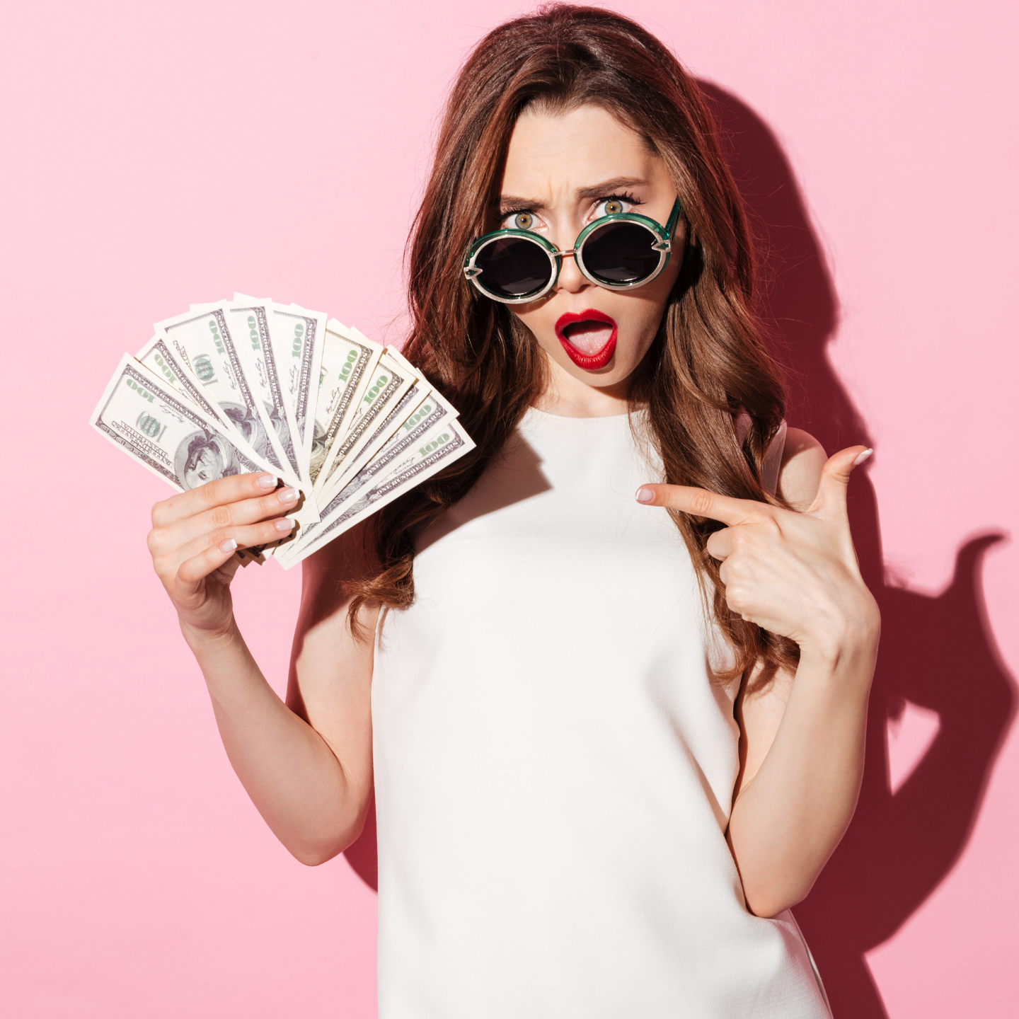woman with sunglasses holding cash