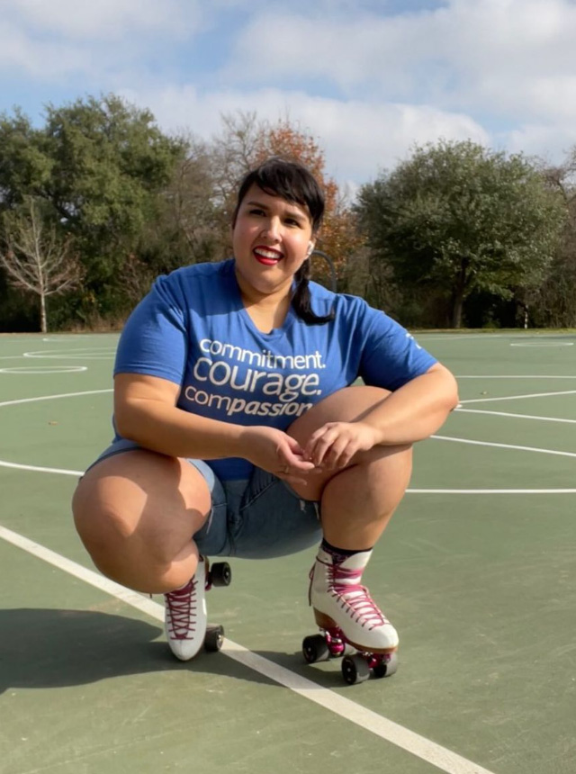 A Woman On Roller Skates Posing on a tennis court