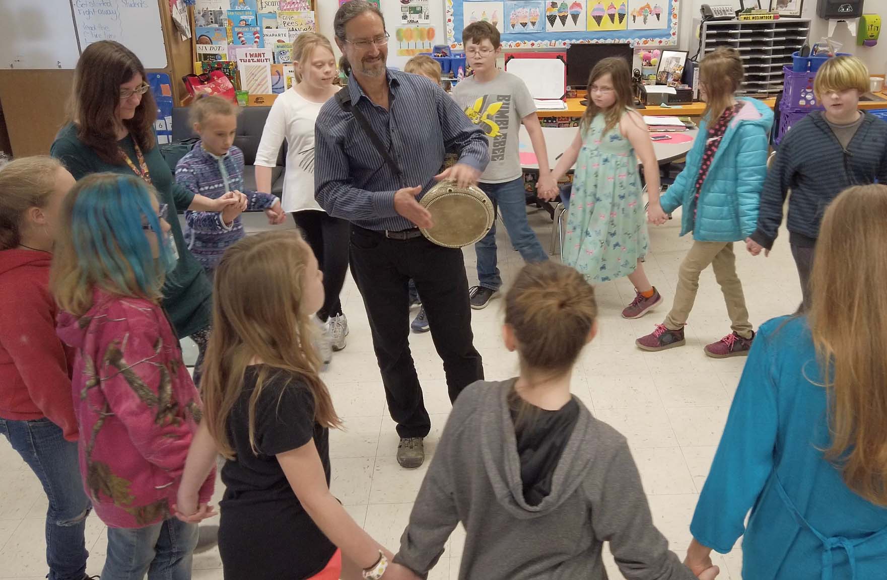 Artist Robert Peak teaching Mid East drumming and dance to grade 3 students