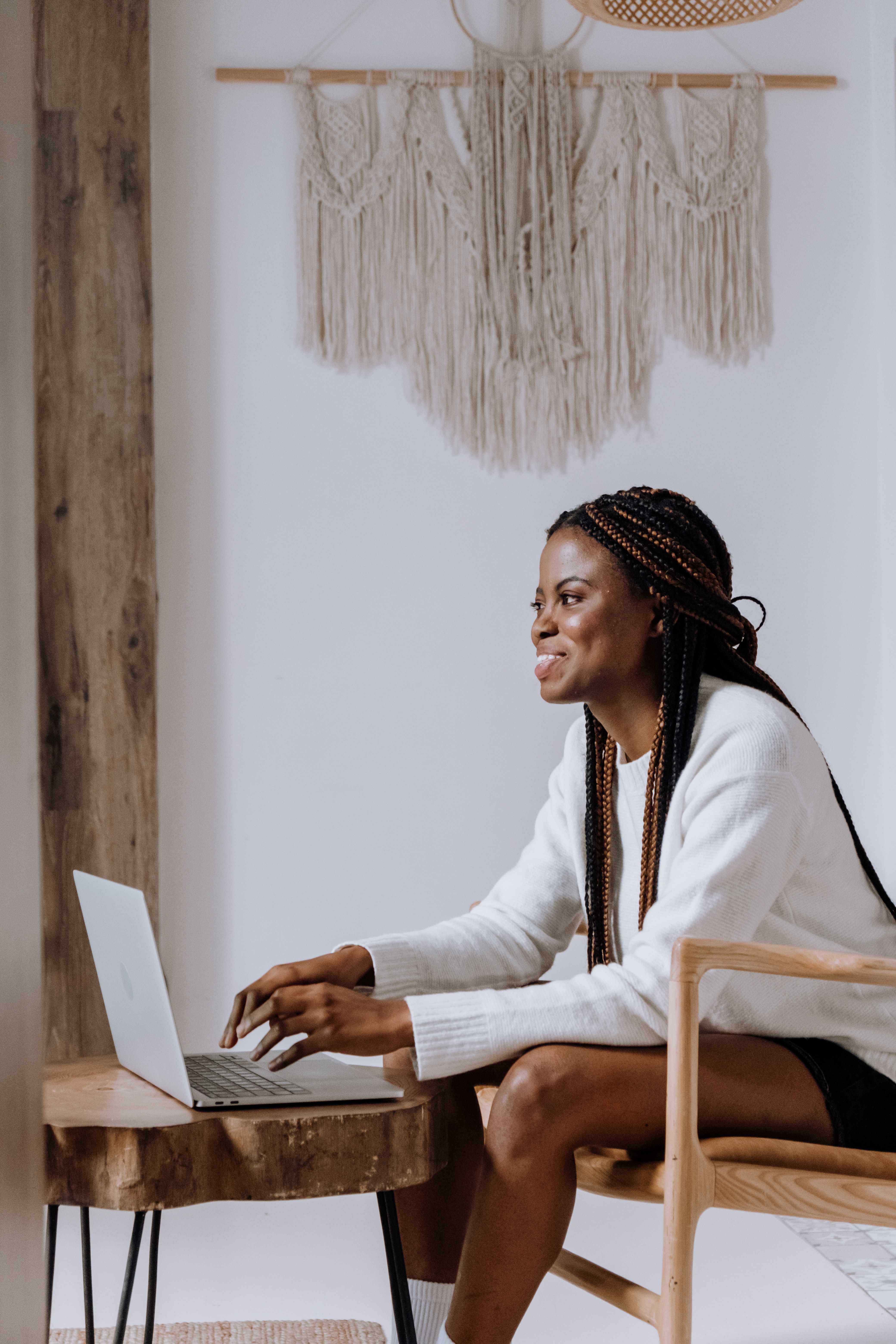 person sitting in front of computer smiling