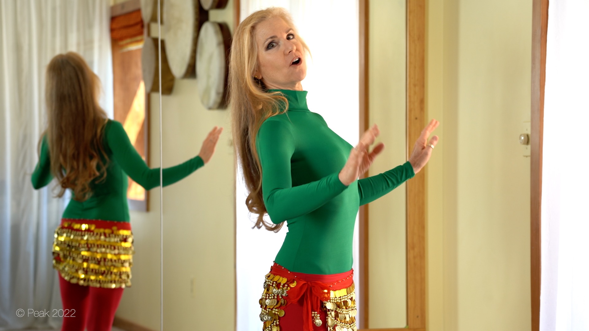 Jensuya belly dancer showing Bob and drum in studio