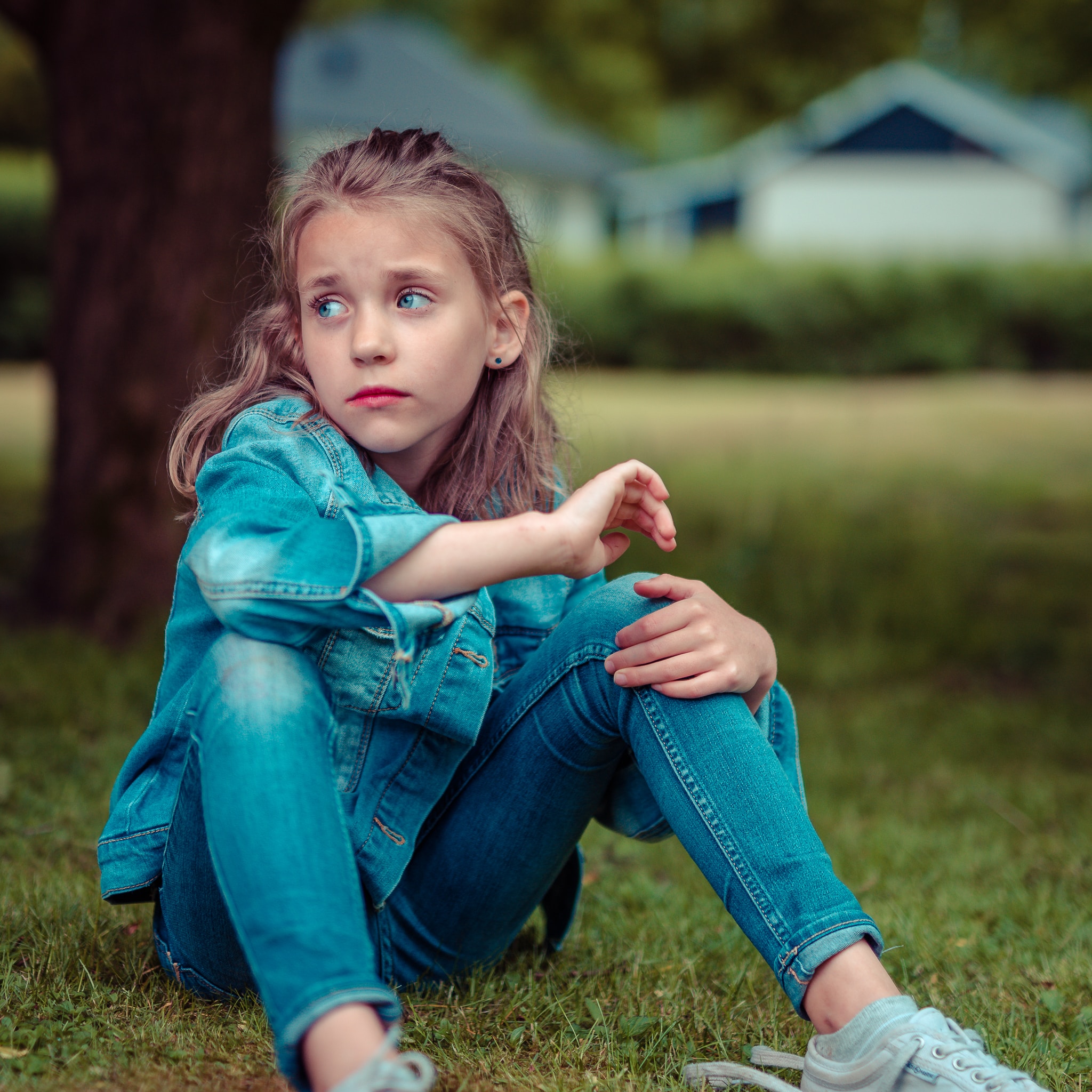 girl sitting outside with regret