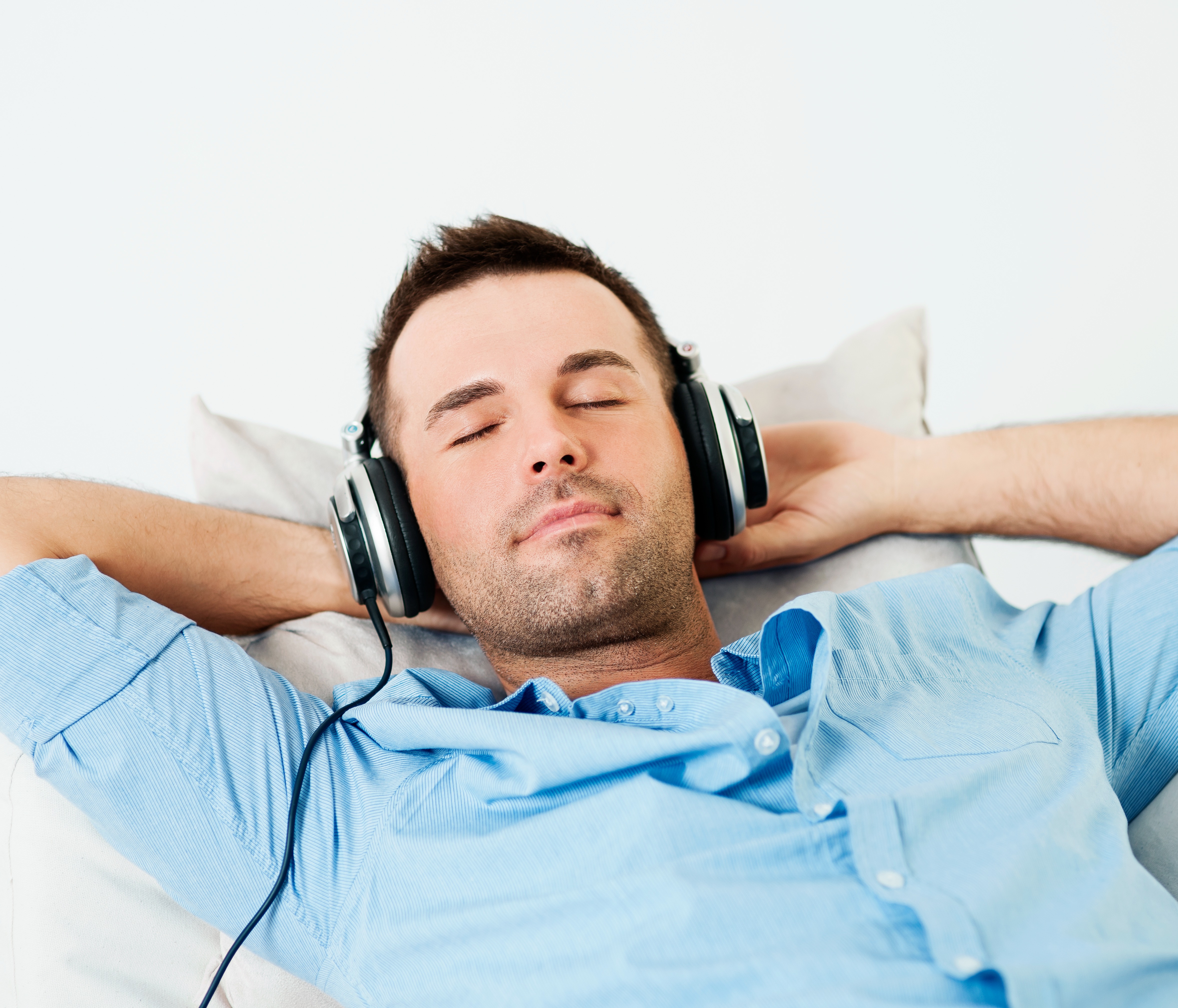man-relaxing-headphones-eyes-closed
