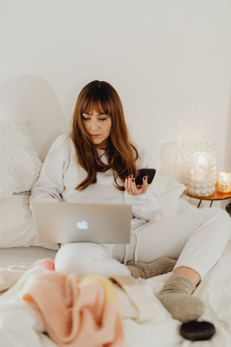 Woman on a bed using Relationship Rescue.