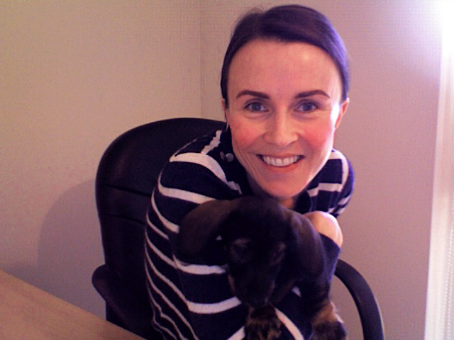 Course creator and her Dachshund puppy sat on a chair