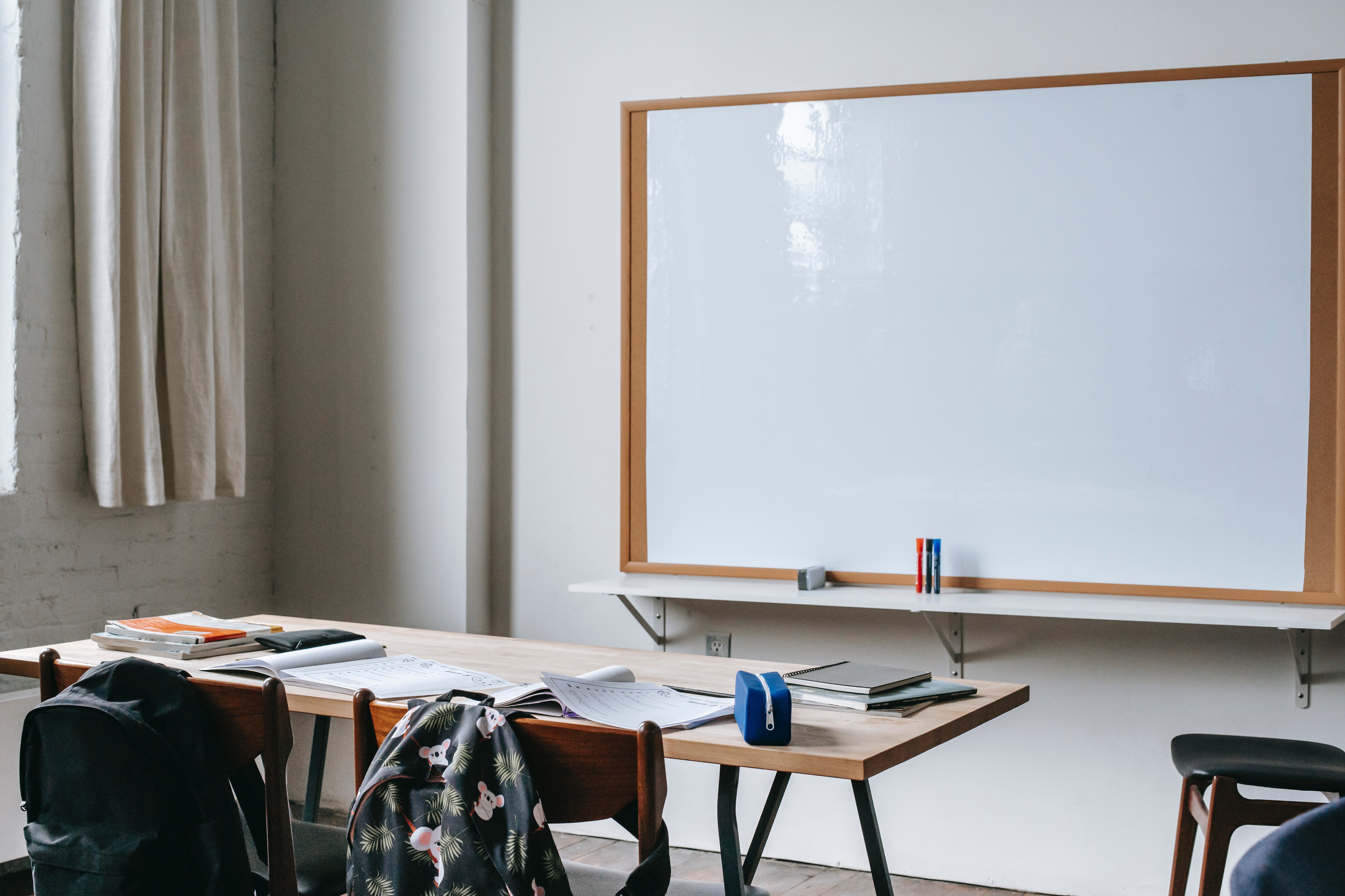 table in front of whiteboard