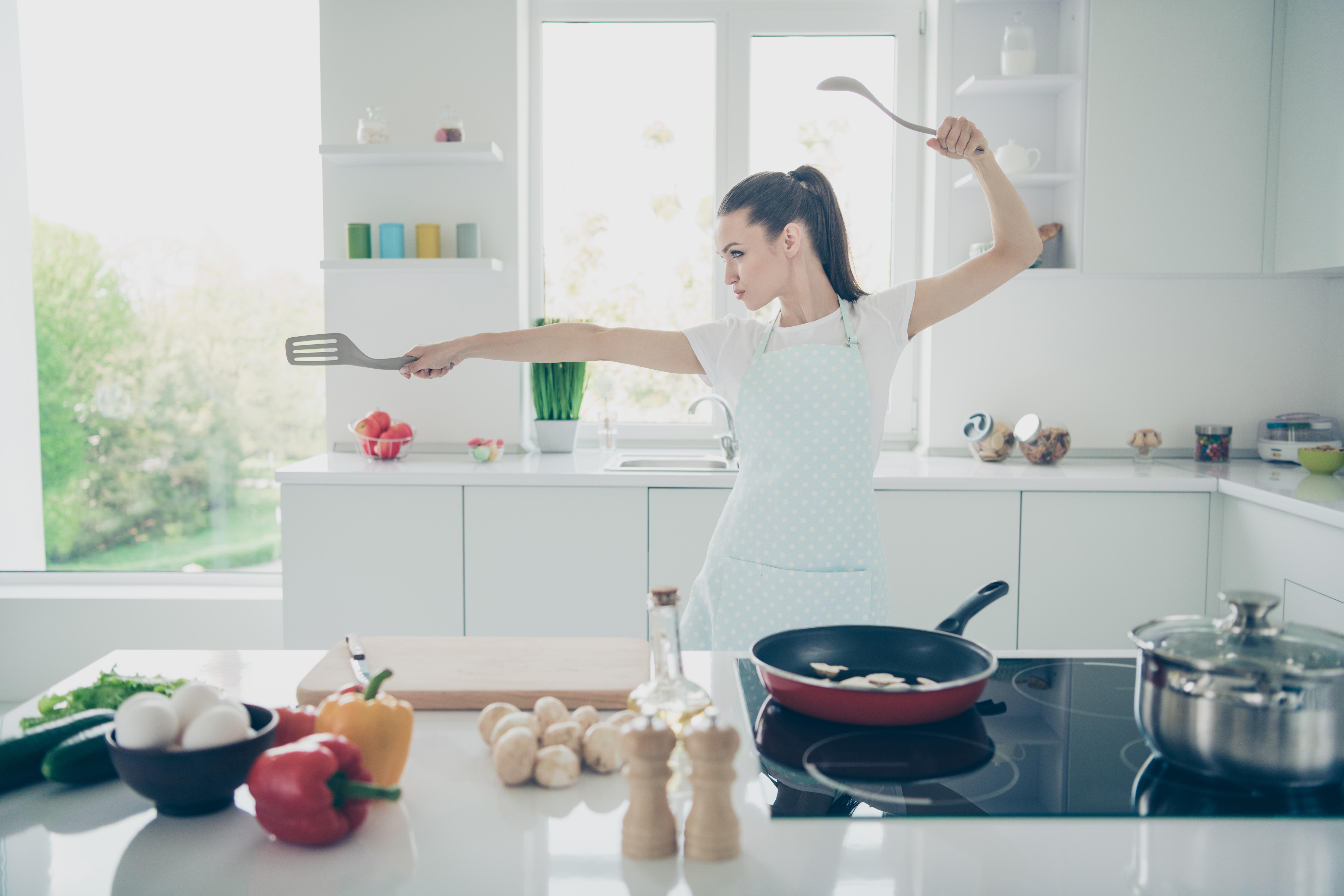 Kitchen ninja, woman cooking vegan food  