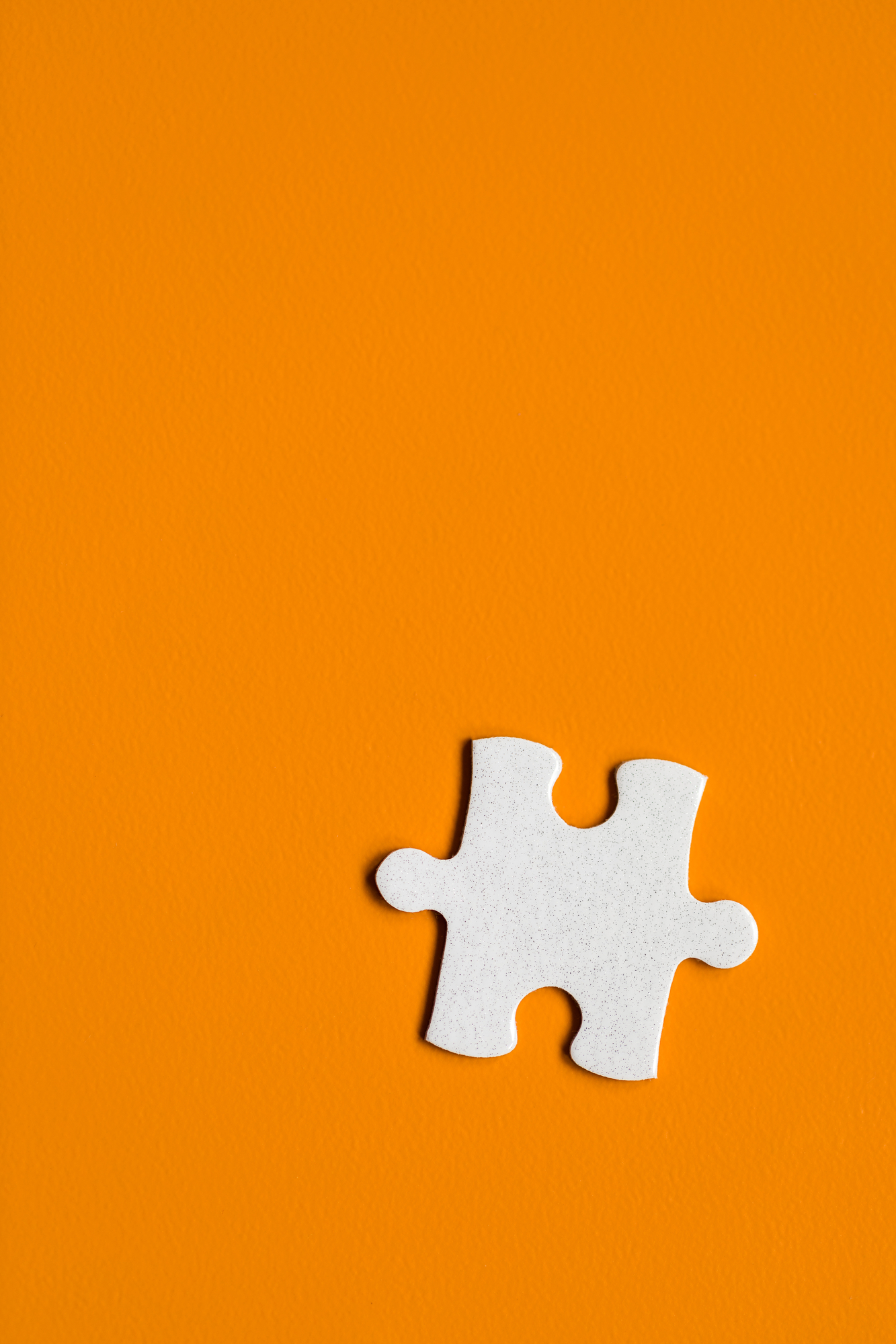 orange background with single puzzle piece