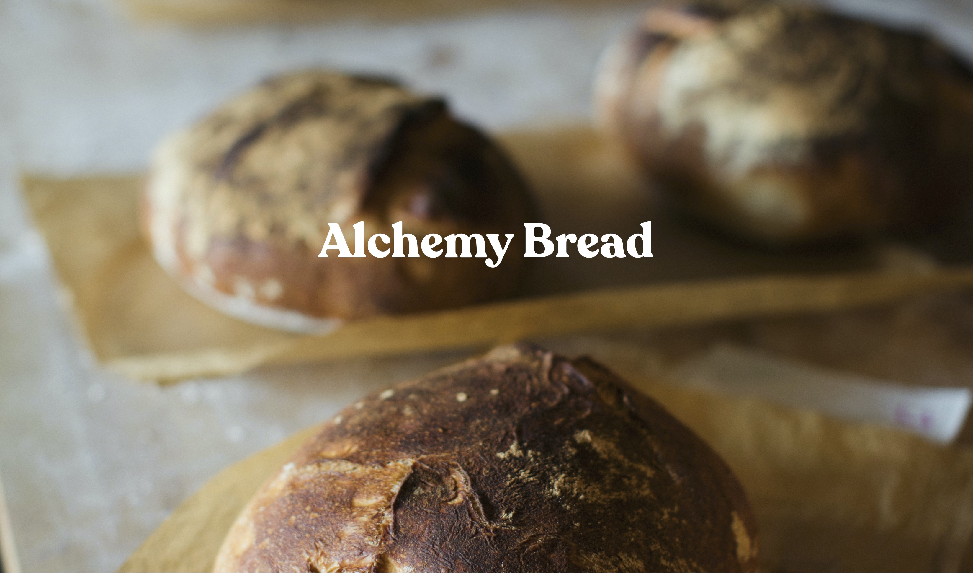 three golden loafs of fresh baked bread
