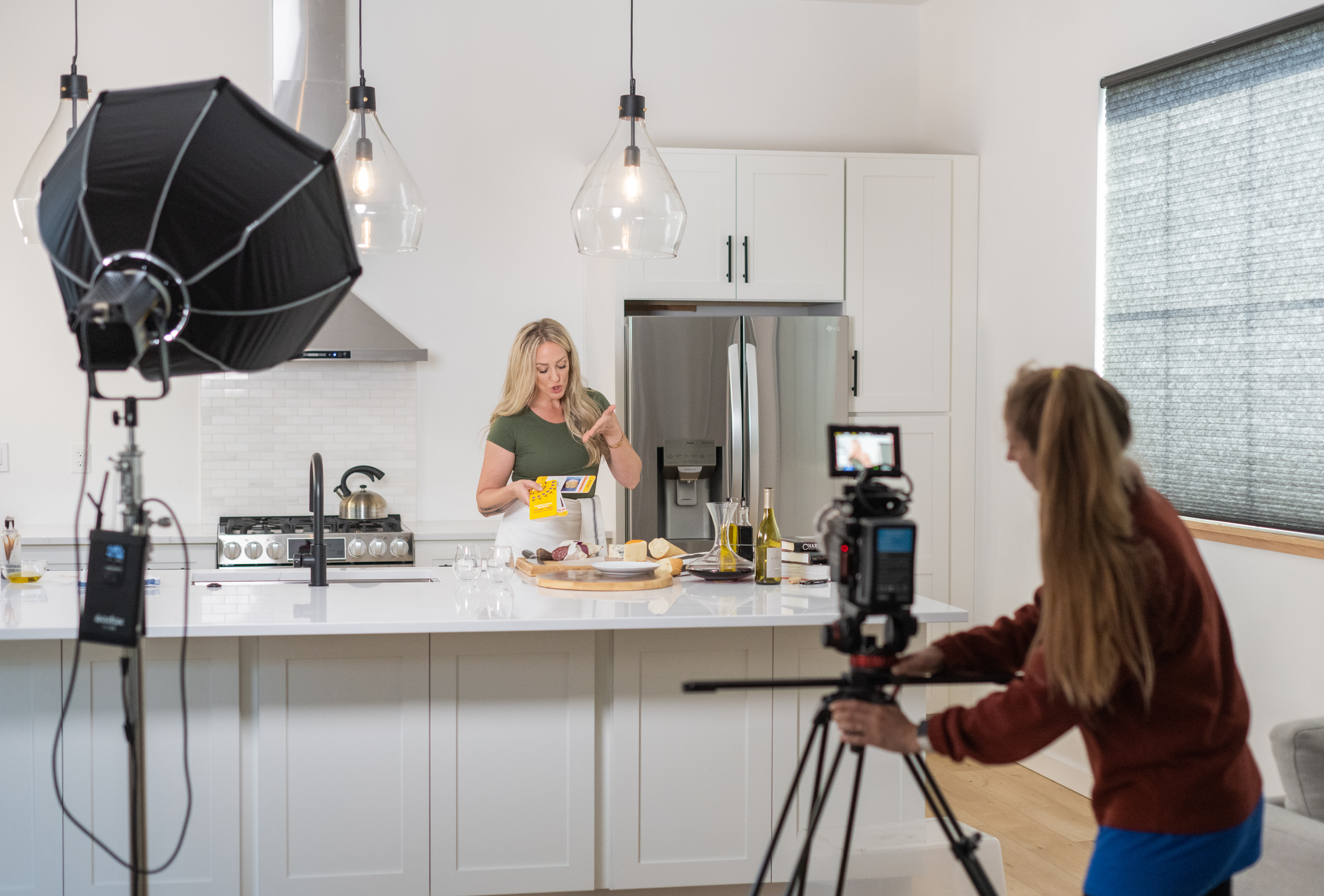 Chef Siiri Sampson sets up a cooking class in a white studio room 