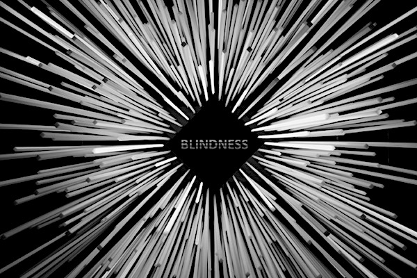 An abstract picture with shafts of white light being sucked into a central black diamond which has the word &#39;Blindness&#39; written on it