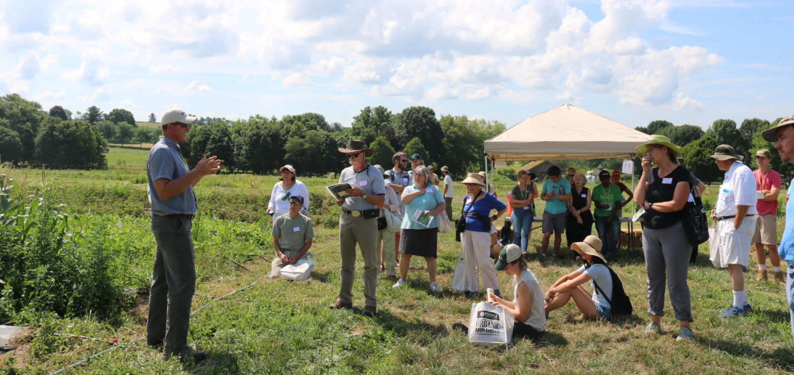 Drew speaking to group of Organic Field Days attendees