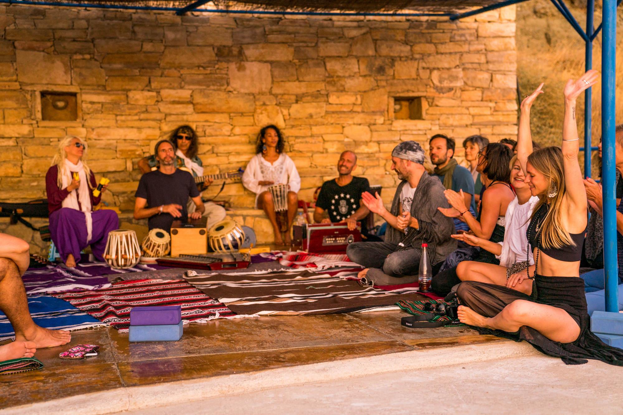 A group of people singing and playing musical instruments