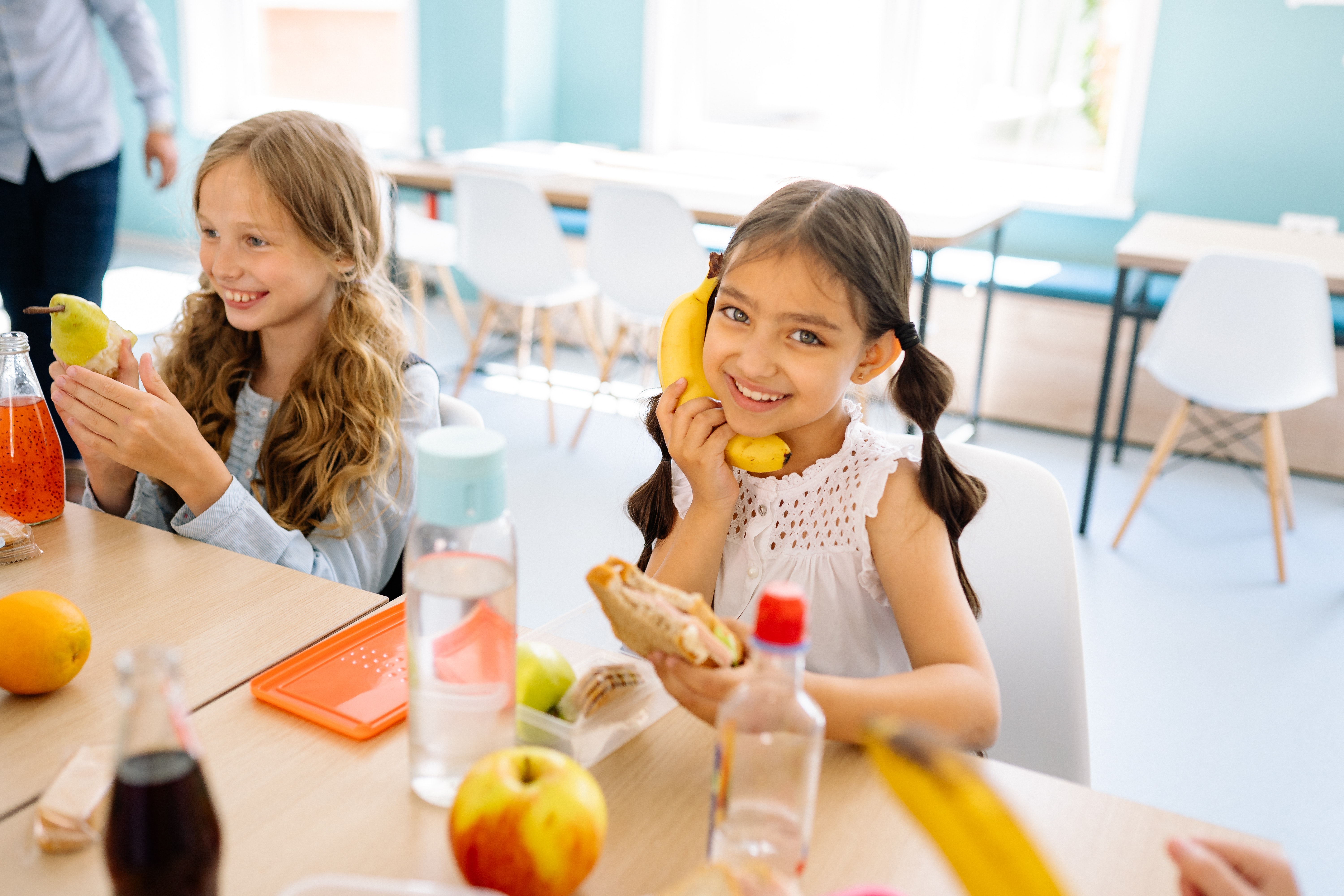 smiling student at lunch table