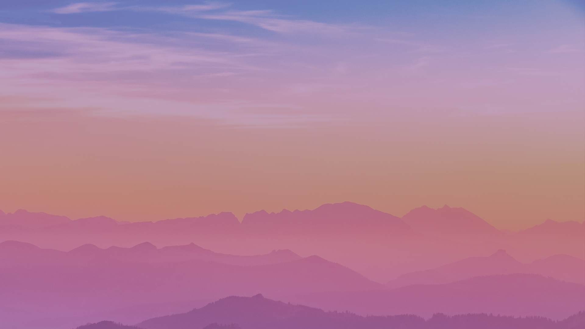 Golden sunset turns mountain range into dreamy pinks