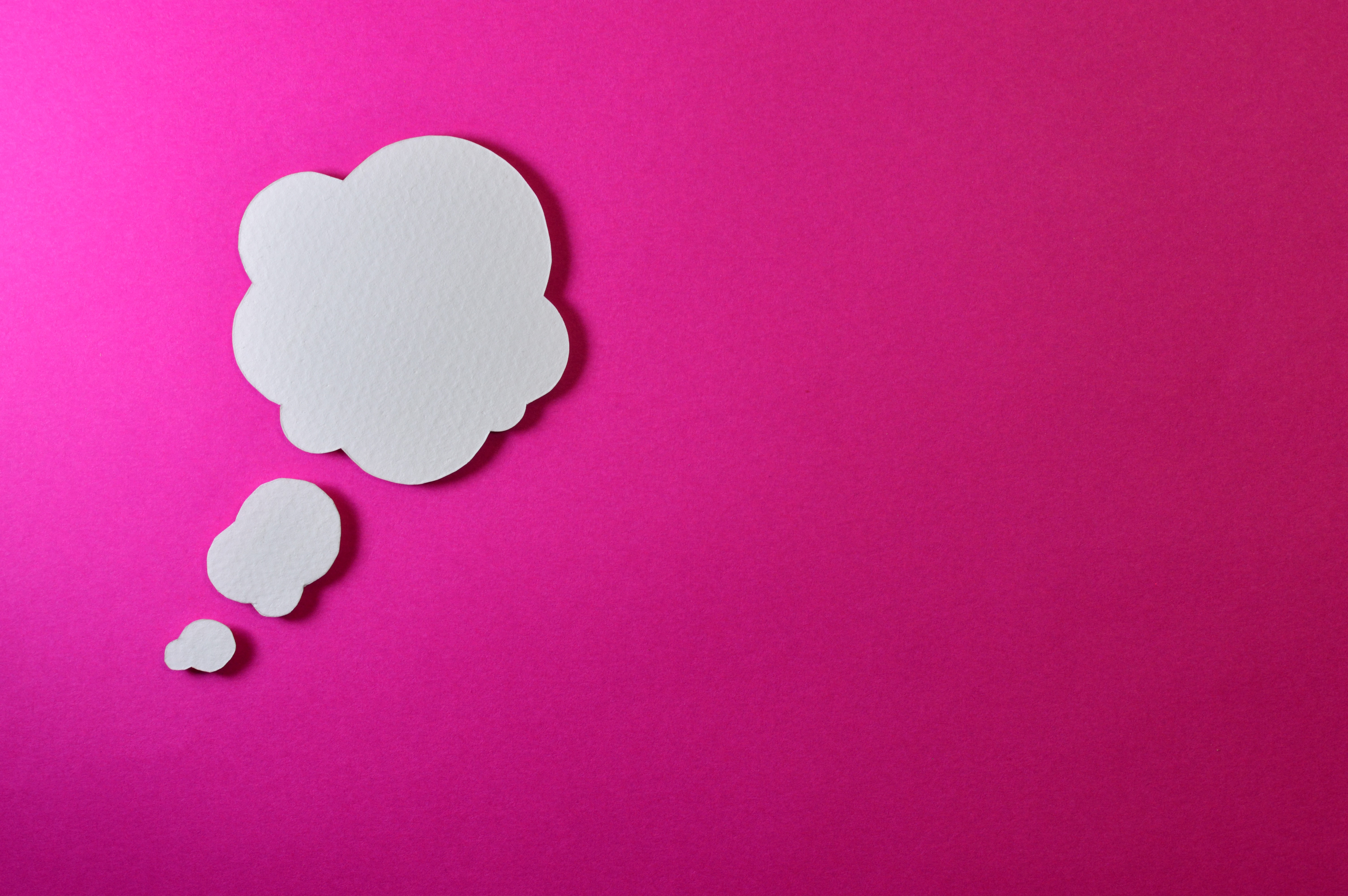 thought bubbles on a pink background