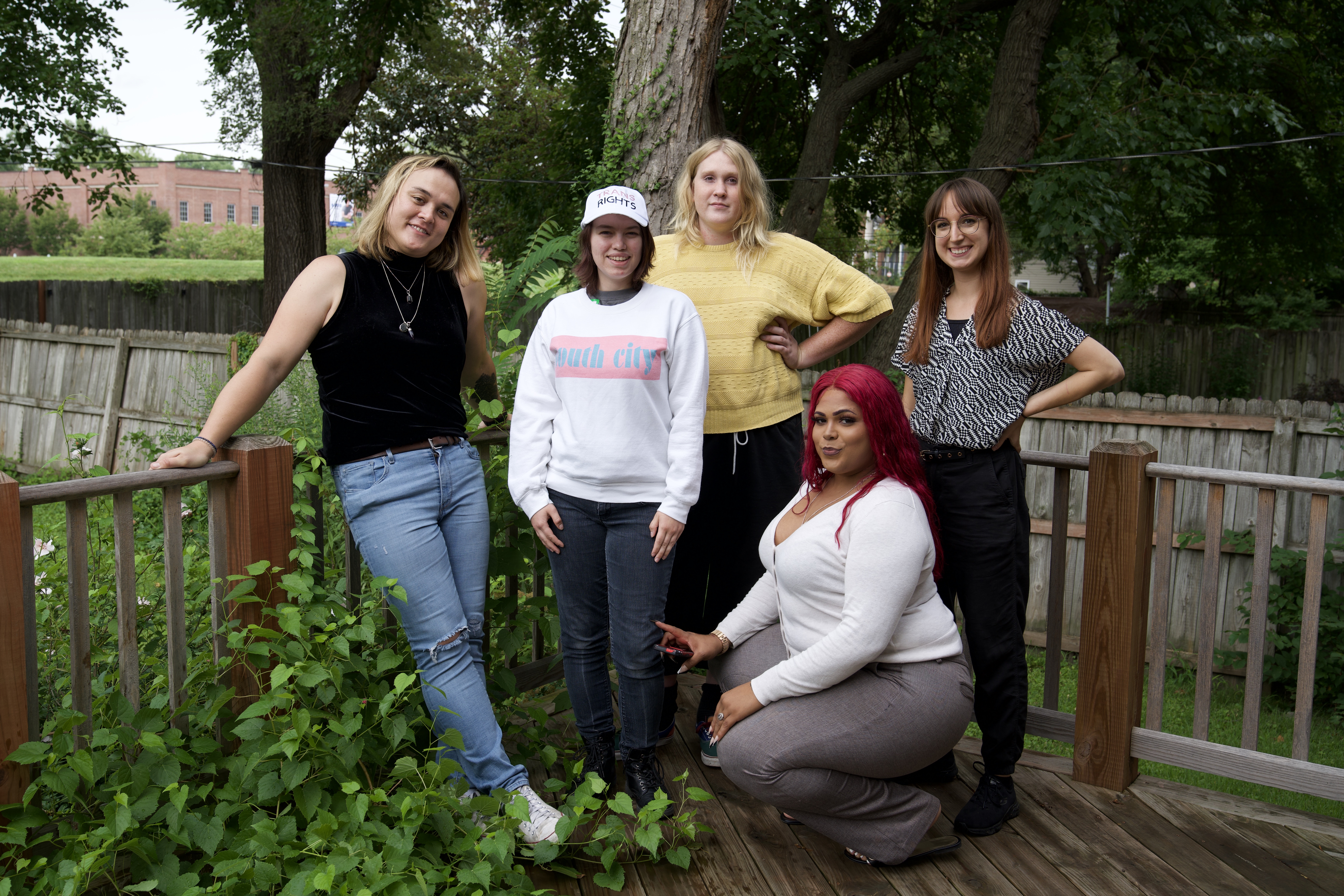 Five MTUG staff members pose for a picture outside