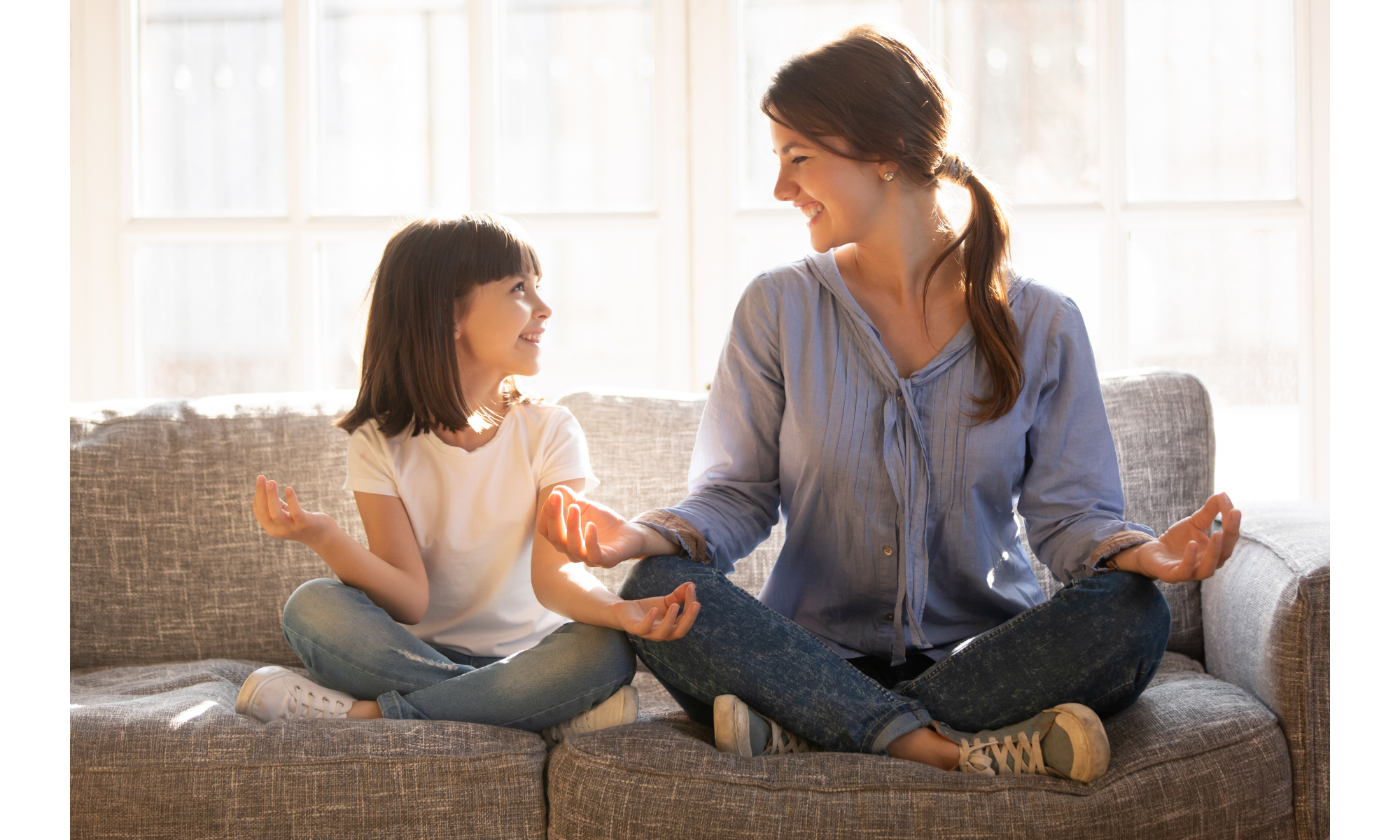 Mother and daughter meditating