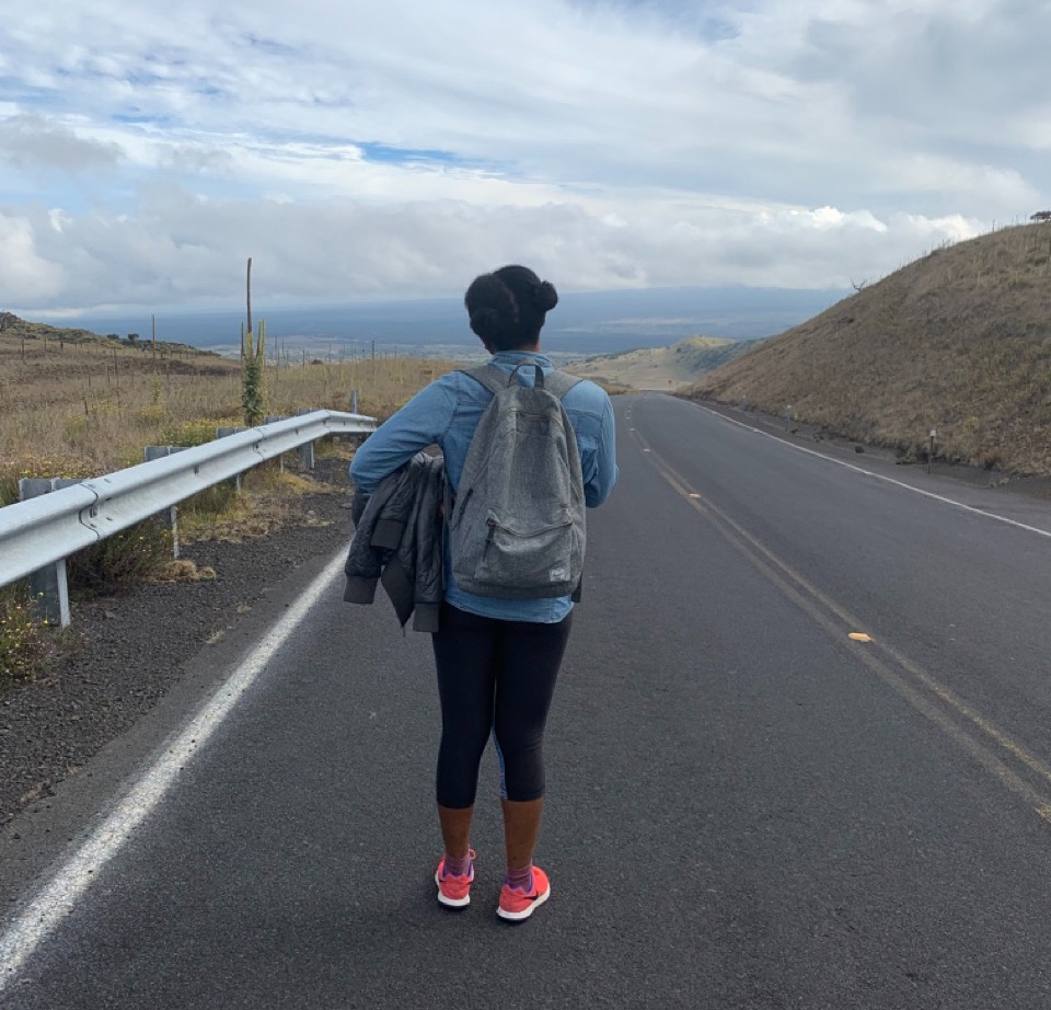 Solo traveler, walking along a road