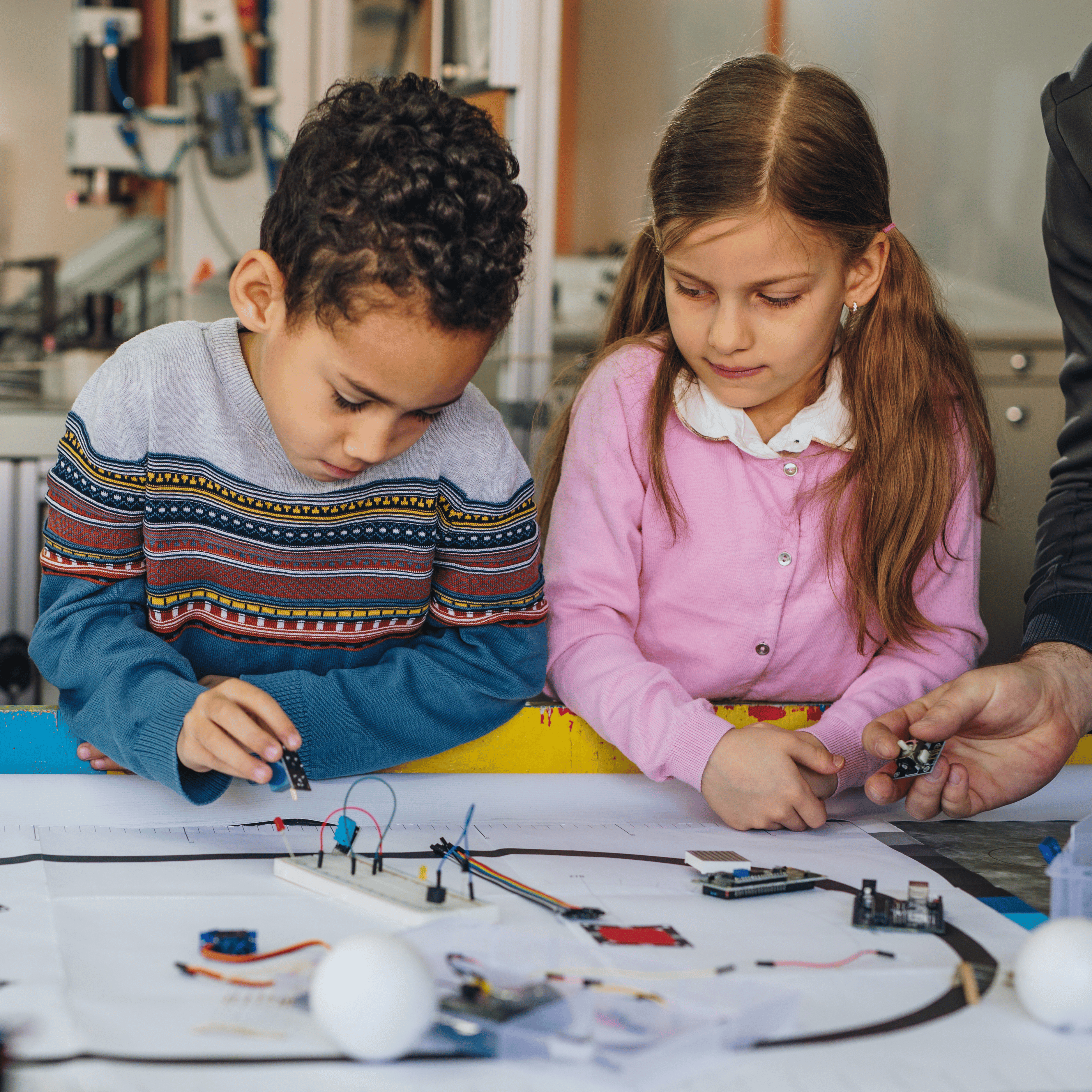 two students using robotics