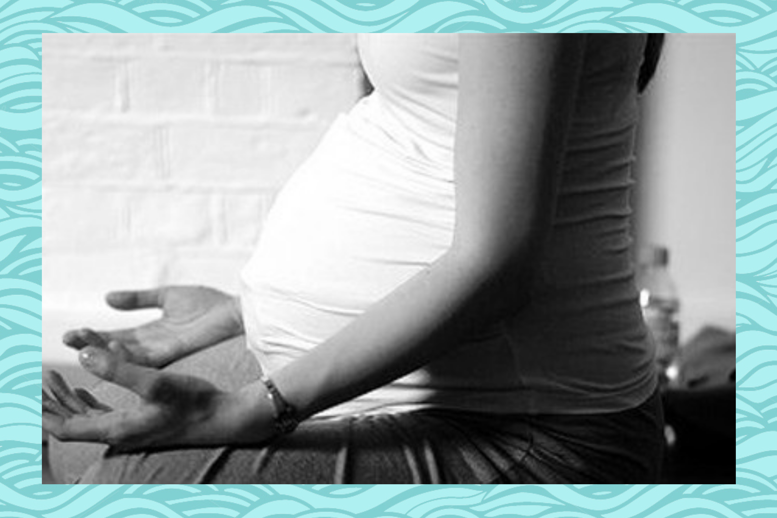 pregnant woman sitting yoga relaxed