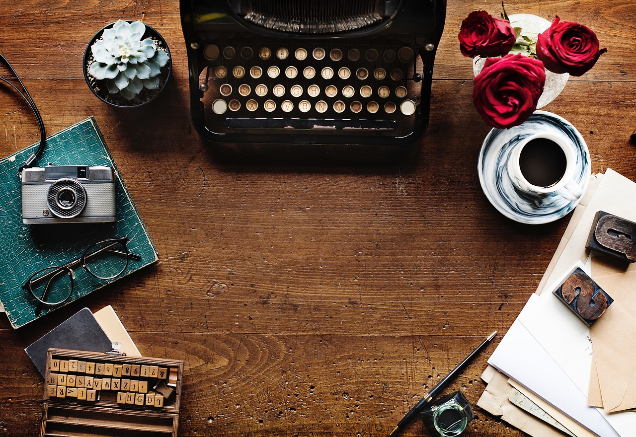 Typewriter, coffee, and books