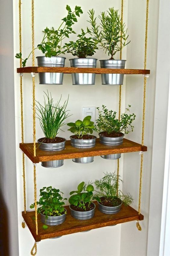 hanging shelves with built in planters and herbs