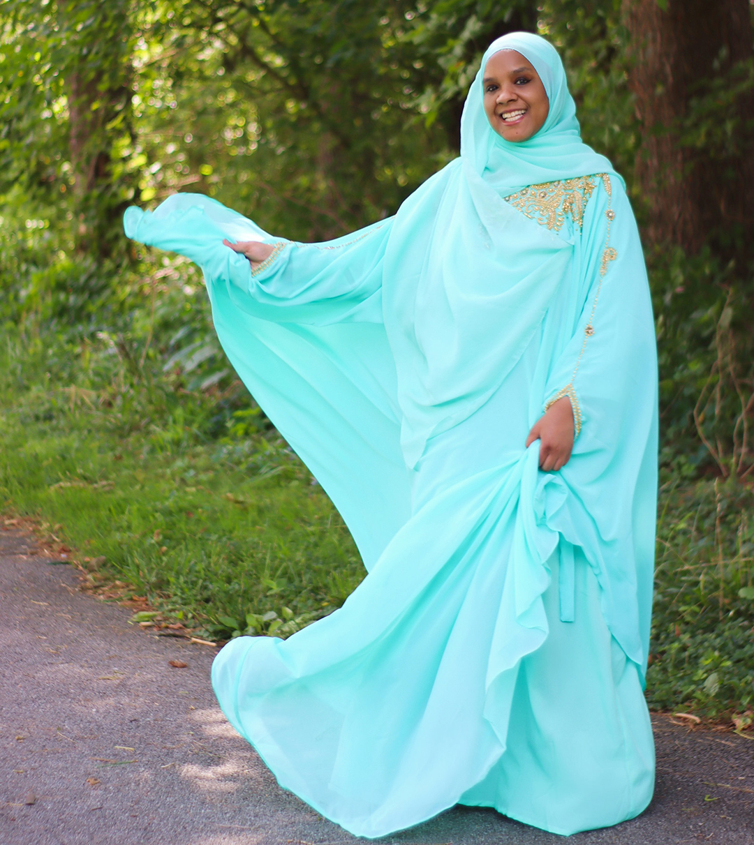 Photo of Umm Zakiyyah in blue hijab and garment