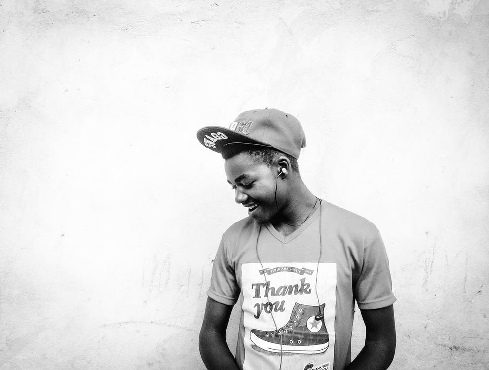 Teen looking down, wearing a thank you t-shirt