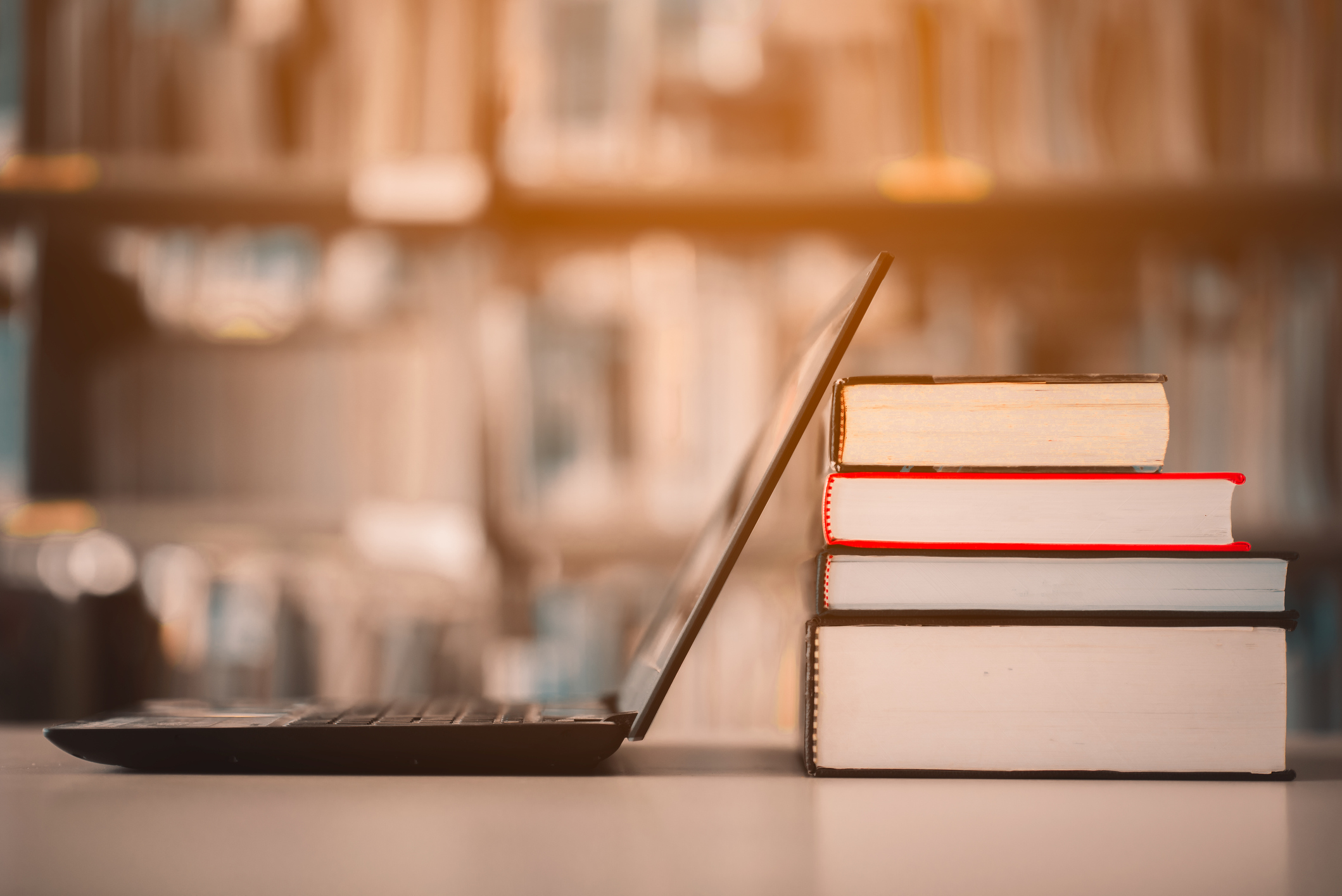 Picture of a laptop and books to show learning