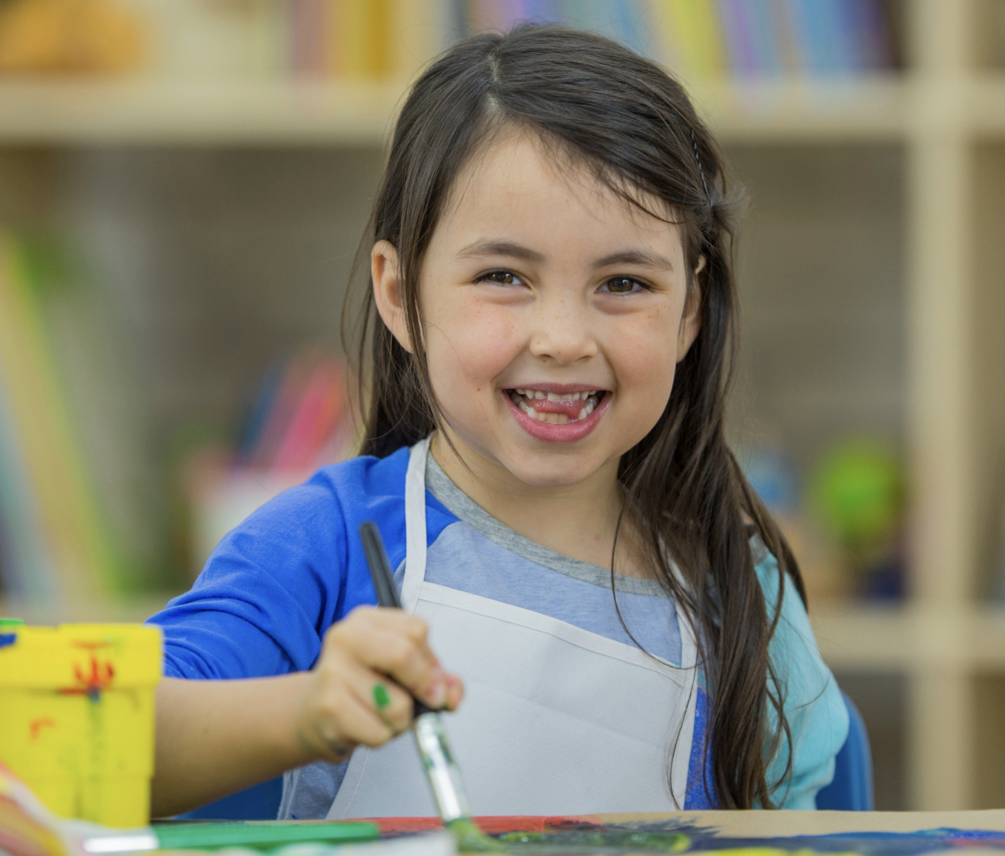 Happy kid playing with colors