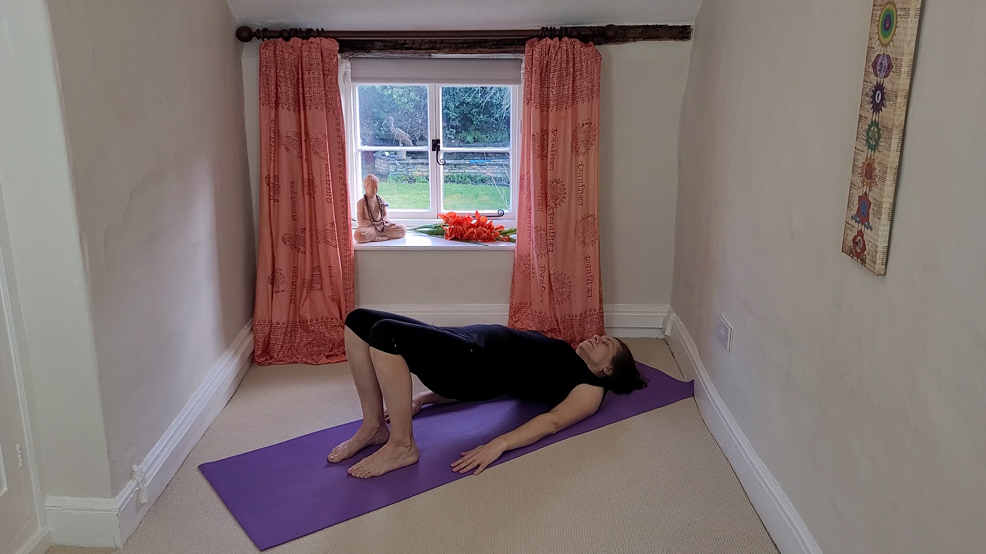 Yoga teacher Deb King demonstrates the Bridge pose