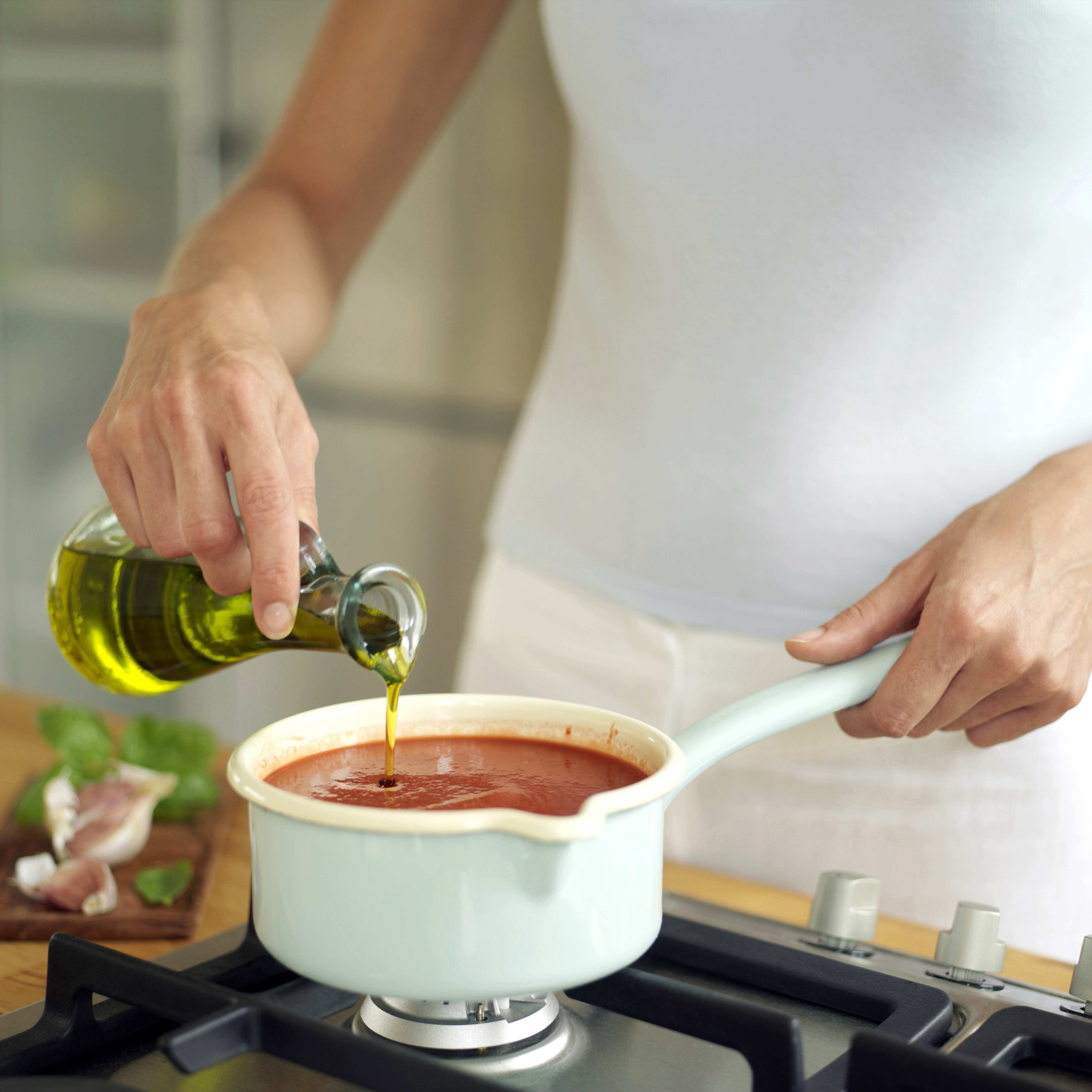 Cooking tomato soup.