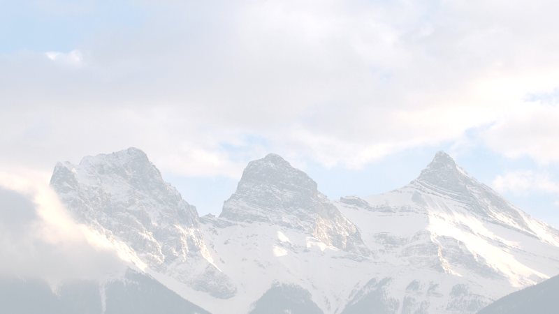 A photo of a beautiful mountain range called The Three Sisters, in Canmore