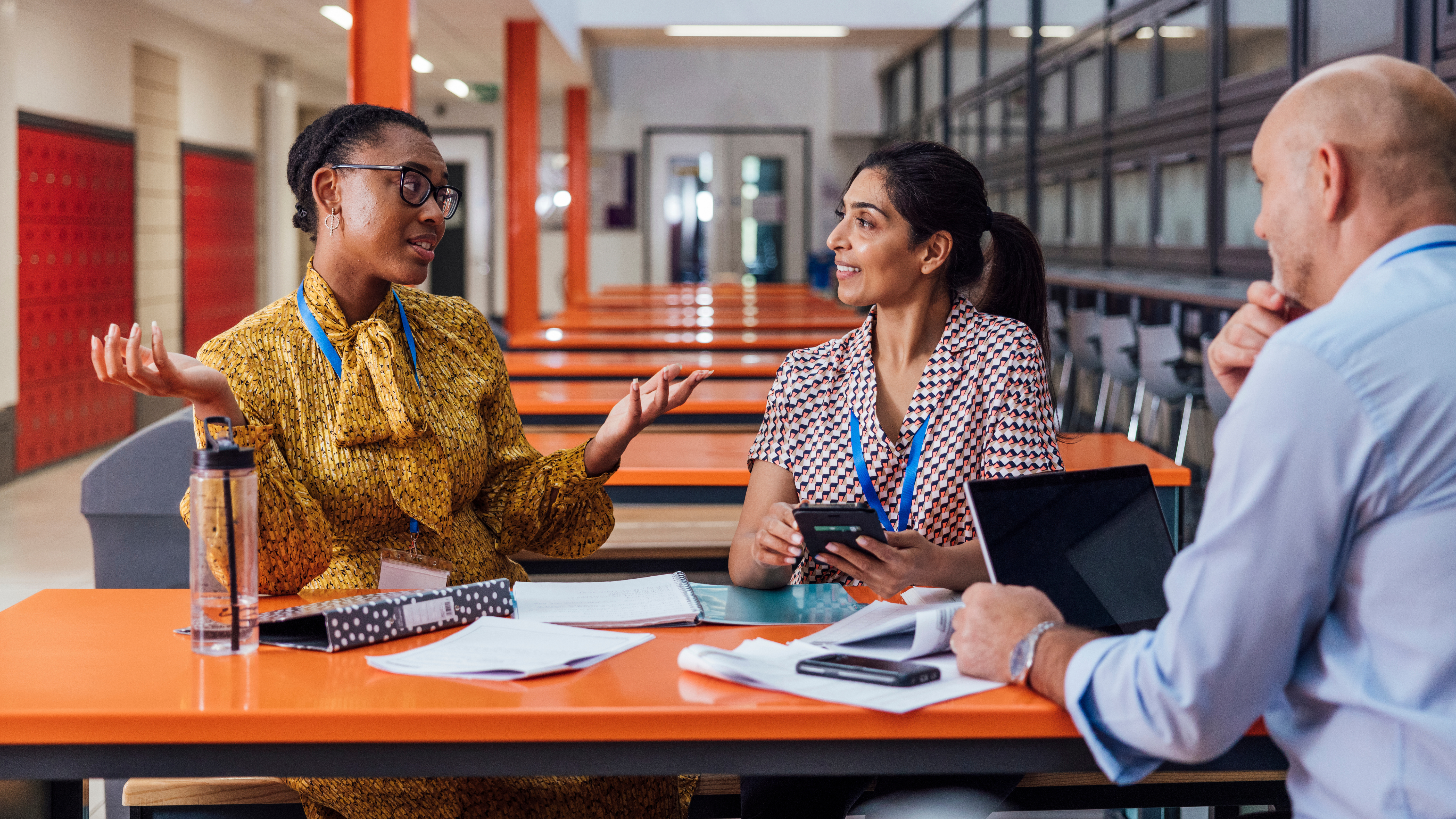 teachers planning together around a table