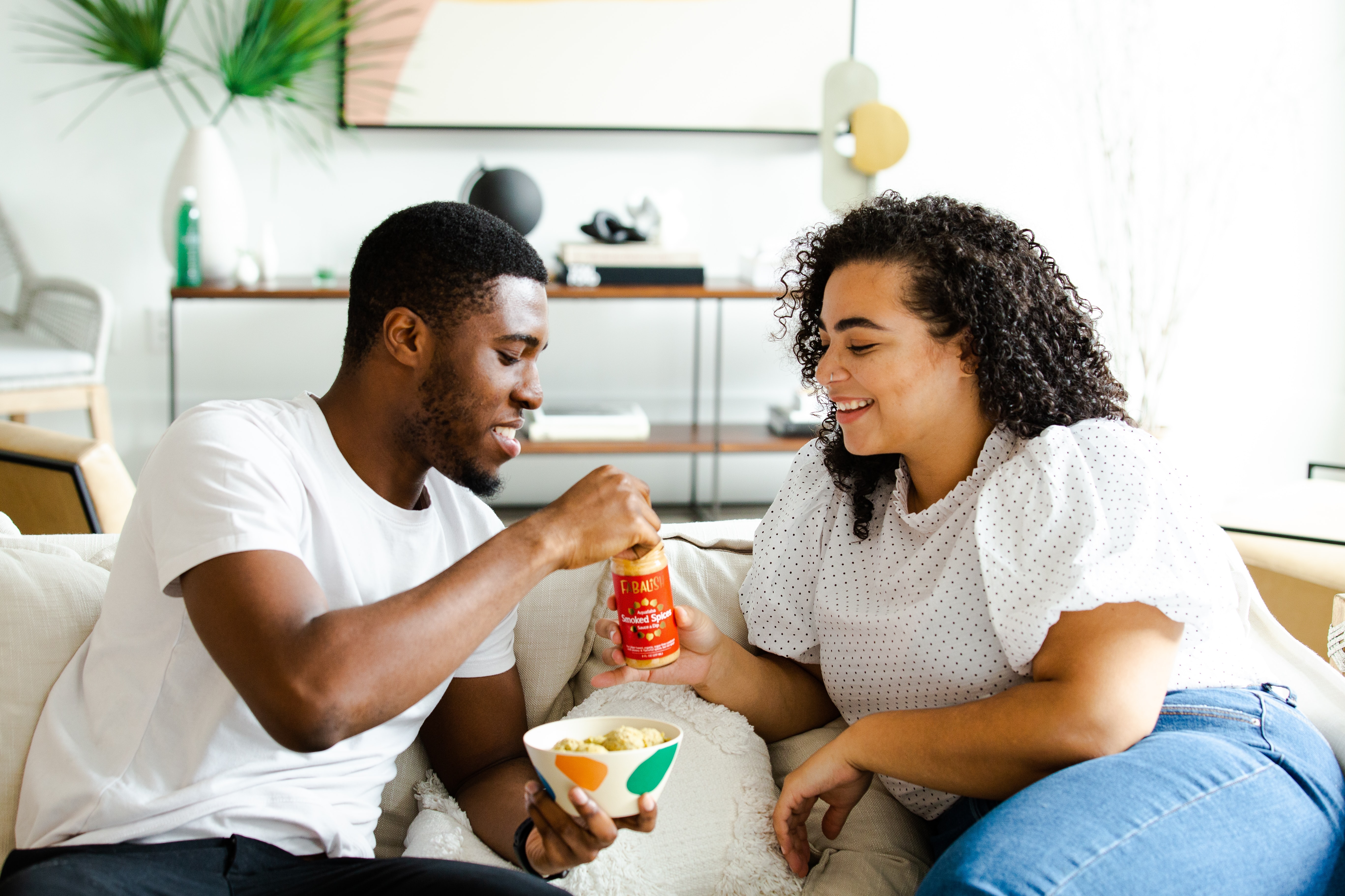 people eating on a couch