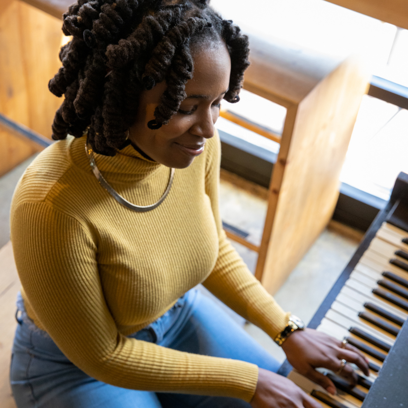 Adult woman enjoys relaxing with the piano.