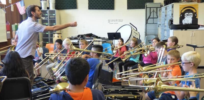 Nick (teacher) teaching a group of young students