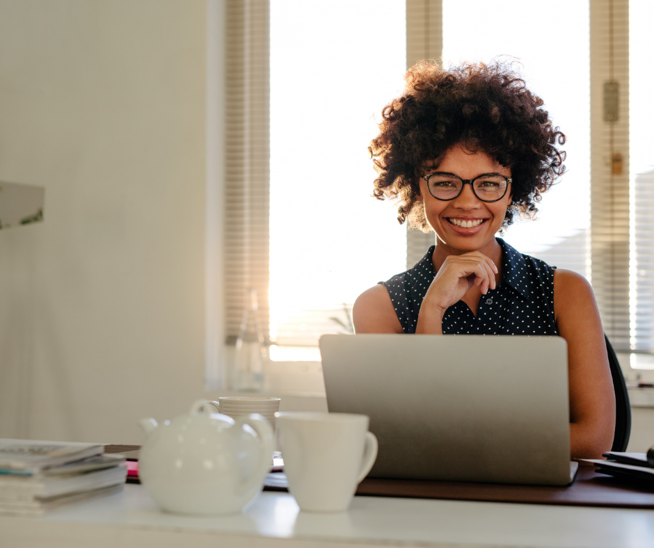 woman at desk with coffee